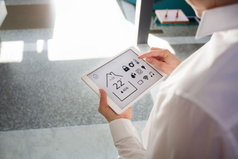 man-controls-smart-home-devices-using-digital-tab